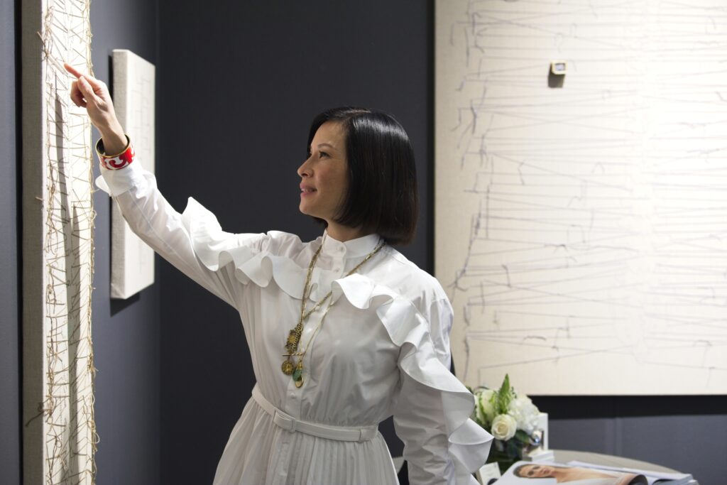 Lucy Liu talks to Napa Valley Museum Yountville staff about the “Totem” series in her exhibition: “Lucy Liu: One of These Things Is Not Like the Others.”
Photo: Lowell Downey